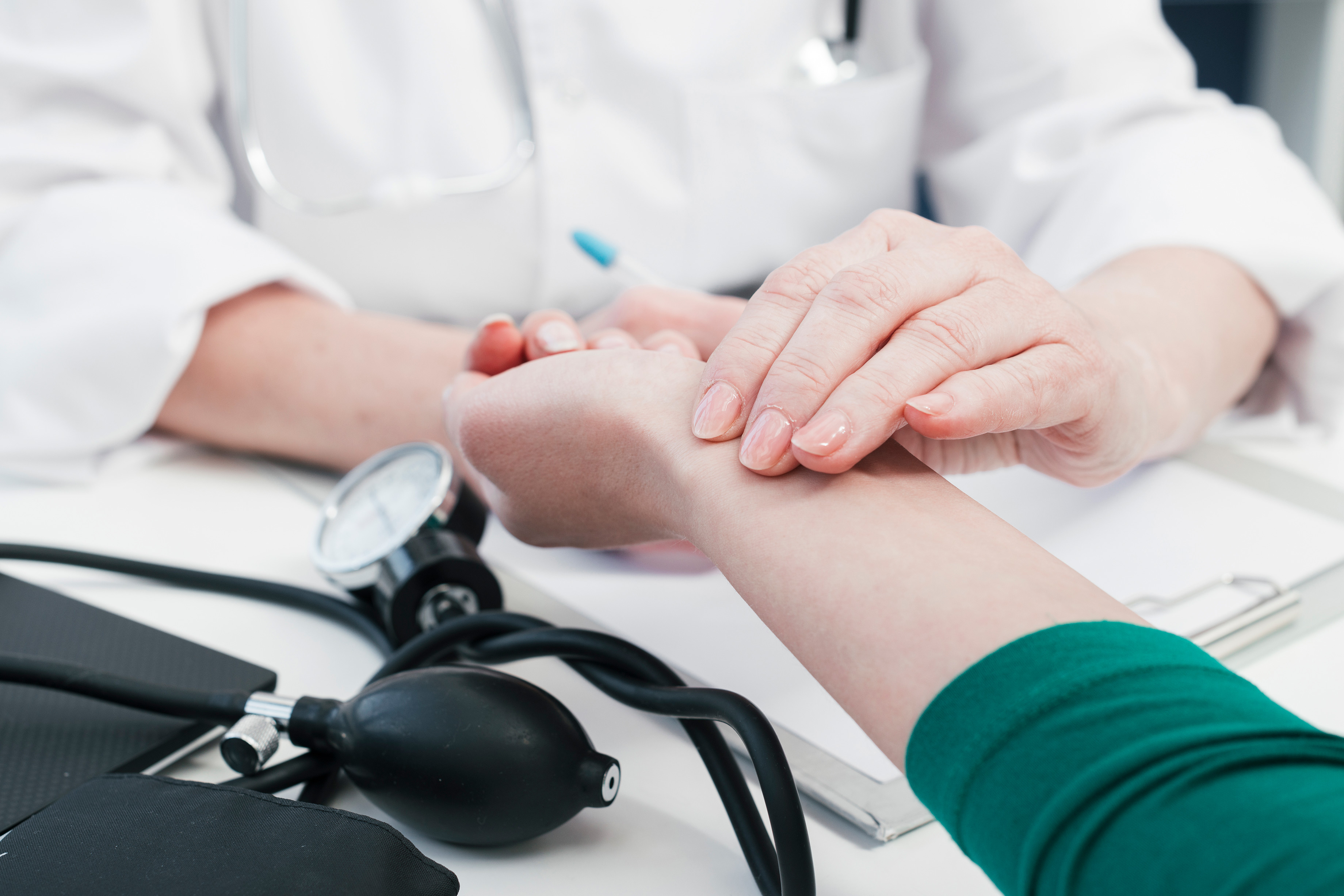 doctor s hand tending patient